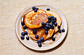 Blueberry pancakes and maple syrup