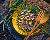 Calamari salad with broad beans and spring onions