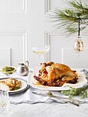 Stuffed roast chicken with fries boulangère and salsa verde