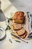 savoury courgette, cheese and sage loaf cake with pumpkin seeds, sliced.