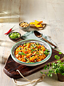 African peanut sweet potato pot with black beans and mango