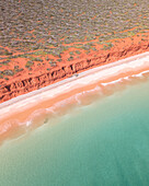 Aerial view of bottle bay with beautiful turquoise water and red cliffs, Denham, Australia.