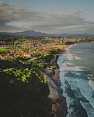 Aerial view of Bidart in the morning, with the Atlantic Ocean and the Pyrenees mountains in the background, French Basque Country, France.