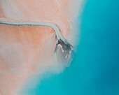 Aerial view of an abstract blue and turquoise clay lake, Art-sur-Meurthe, France.