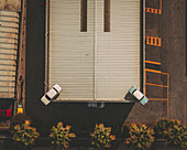 Aerial view of cars above a garage, Albenga, Italy.