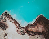 Aerial view of an abstract blue and turquoise clay lake, Art-sur-Meurthe, France.