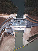 Aerial view of Seine River Retention Basin with dam and surrounding forest, Gravon, France.