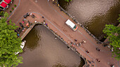 Aerial view of people cycling in Amsterdam city center, The Netherlands.