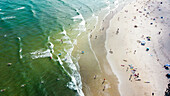 Aerial view of Happy Valley Beach with surfers and swimmers, Caloundra, Queensland, Australia.