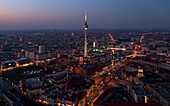 Aerial view of Berlin skyline with famous TV tower in twilight during blue hour, Germany