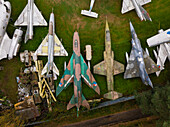 Zruc Senec, Czech Republic - 12 September 2024: Aerial view of an abandoned airplane and helicopter graveyard with rusty aircraft collection, Zruc Senec, Czech Republic.
