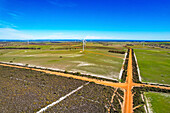 Aerial view of wind farm with wind turbines and expansive farmland, Nambung, Australia.