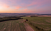 Aerial view of Vetrny mlyn windmill at sunrise over beautiful fields and tranquil countryside, Chvalkovice, Czech Republic.
