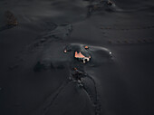 Aerial view of a building covered with ashes from Cumbre Vieja volcano in La Palma island, Canary Islands, Spain.