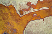Aerial view of abstract patterns and textures of Redbank salt farm, Pilbara Region, Australia.