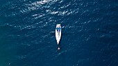 Aerial view of a sailing boat moored in mediterranean sea