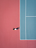 Aerial concept of a person on a tennis court.