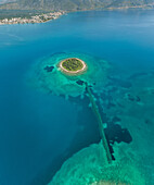 Aerial view of small islet of Itea called Agios Athanasios in Greece