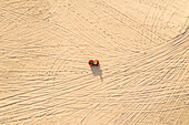 Aerial view of a quad bike on the sand, Taiba, São Gonçalo do Amarante, Ceará, Brazil