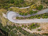 Aerial view of a bend in countryside of Greece.