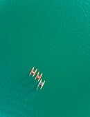 Aerial view of group of people having fun while riding water bikes at lake Plastira in Greece