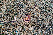 Aerial view of people celebrating the Holi Colour festival at Shri And Baba Temple in Nandgaon, Uttar Pradesh, India.