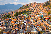 Aerial view of north residential district of Medellin, a dense population favela in town, Antioquia, Colombia.