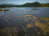 Aerial view of the Secret lake surrounded by green nature in Kampot province, Cambodia.