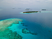 Aerial view of islands with white beach and blue ocean, Baa Atoll, Maldives.