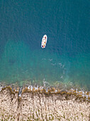 Aerial view of single speed boat floating over transparent water, Croatia.