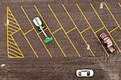 Aerial view of organized parking lot with yellow lines and cars, Vero Beach, Florida.