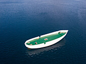 Aerial view of unfinished boat anchored alone at Adriatic sea, Croatia.