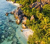 Aerial view of a person with swimsuit at Anse Source d'Argent, a scenic beach with granite formation, La Digue and Inner Islands, Seychelles.