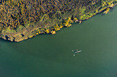 Aerial view of a man doing sport in a Kayak in estuary of river Vouga, in Ria de Aveiro, Bioria, Salreu, Estarrega, Aveiro, Portugal