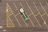 Aerial view of organized parking lot with geometric patterns and yellow lines, Vero Beach, Florida.