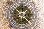 Aerial view of a man laying down on the floor of an abandoned Power plant reactor funnel in Charleroi, Belgium.