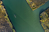 Aerial view of a group of men doing sport in a Kayak in estuary of river Vouga, in Ria de Aveiro, Bioria, Salreu, Estarrega, Aveiro, Portugal