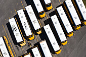 Palm Bay, USA - 27 March 2021: Aerial view of school buses parked in a parking lot, Palm Bay, Florida, United States.