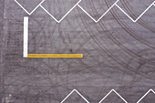 Aerial view of a geometric parking lot with lines and asphalt at a construction site, Wabasso, Florida.