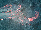 Aerial view of abstract forms created by lava of the continuously active basaltic shield volcano Erta Ale in Ethiopia.