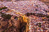 Aerial view of El Tajo Gorge, famous bridge in Ronda during the night, Malaga, Spain