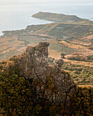 Aerial view of a person on top of Le Chat y La Souris mountain or Mount Villars, in the Bambous Range near Grand Sable, Flacq, Mauritius.