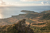 Aerial view of a person on top of Le Chat y La Souris mountain or Mount Villars, in the Bambous Range near Grand Sable, Flacq, Mauritius.