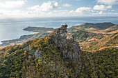 Aerial view of a person on top of Le Chat y La Souris mountain or Mount Villars, in the Bambous Range near Grand Sable, Flacq, Mauritius.