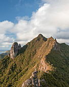 Aerial view of a person on top of Le Chat y La Souris mountain or Mount Villars, in the Bambous Range near Grand Sable, Flacq, Mauritius.