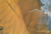 Aerial view of a person on the beach at Playa de los Amantes, Cabo San Lucas, Baja California, Mexico.