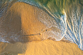 Aerial view of a person on the beach at Playa de los Amantes, Cabo San Lucas, Baja California, Mexico.
