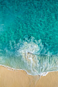 Aerial view of crispy waves along the shoreline at Playa de los Amantes, Cabo San Lucas, Baja California, Mexico.