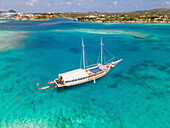 Aerial view of a sail boat off the coast of Aruba.