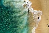 Aerial view of a person on the beach at Playa de los Amantes, Cabo San Lucas, Baja California, Mexico.
